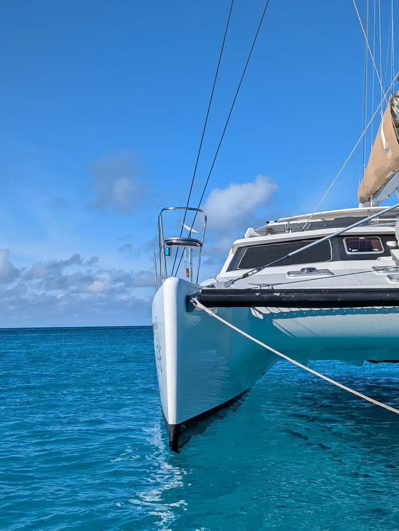 Tropicalia — Voyage 500 catamaran bow in turquoise Caribbean water