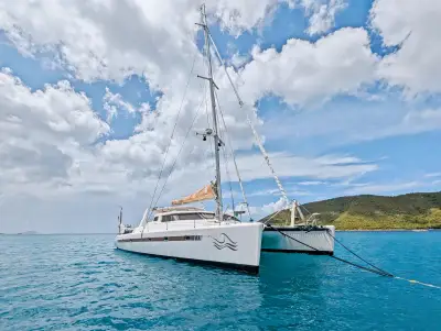 Tropicalia at anchor, starboard profile
